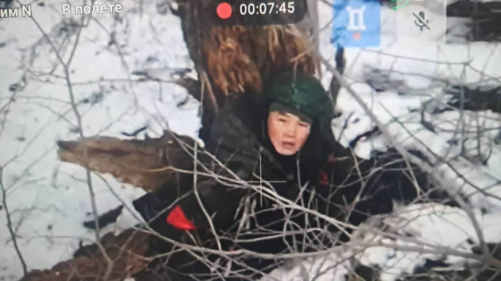 This screenshot from a Ukrainian drone purports to show a North Korean soldier in the snow somewhere in the Kursk region. It is possible the soldier could be from one of Russia's many ethnic Asian citizens from its far eastern states, but the red armband and multiple reports on the subject seem to indicate otherwise.