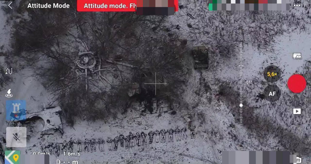 Dead soldiers of Pro-Russian forces, presumed to be North Korean and Russian soldiers, lined up in a frozen field in the Kursk area of operations. Independent verification of exact locations and individual units is currently impossible.