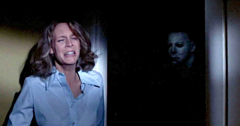 Jamie Lee Curtis stalked by Michael Myers in the original 1978 slasher film Halloween. 